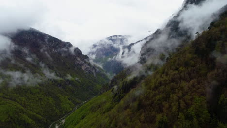 Flying-through-the-clouds-above-Nemuna-National-Park,-Kosovo