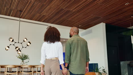 couple holding hands in a modern interior