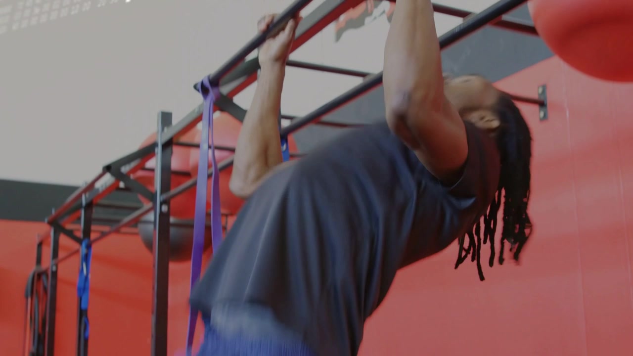 Hanging grip starting man pulling up, leaning gripping barbell, text overlay growing, for strength