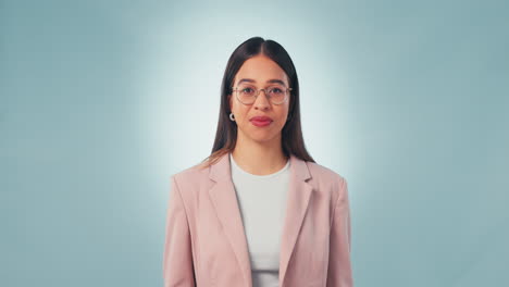 Woman,-hands-or-doubt-on-blue-studio-background