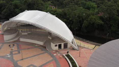 aerial view of an open stage podium that turns slowly around the podium