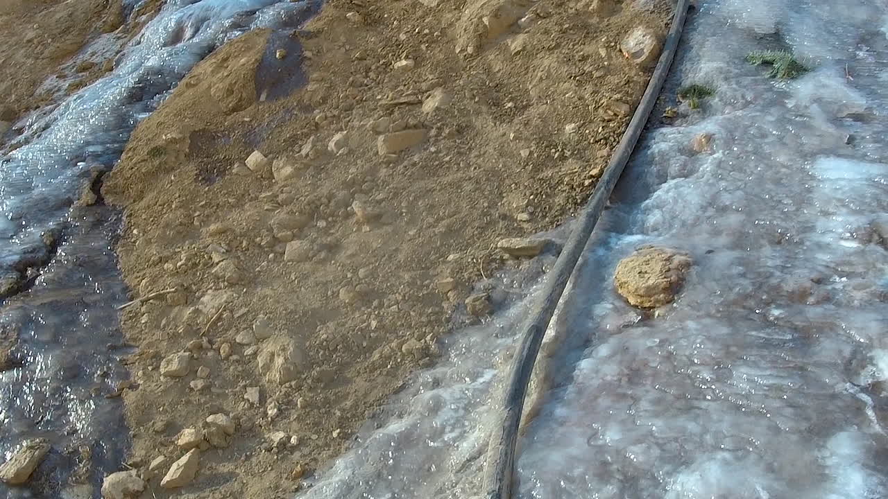 Frozen water flowing in the ground at high altitude in Nepal