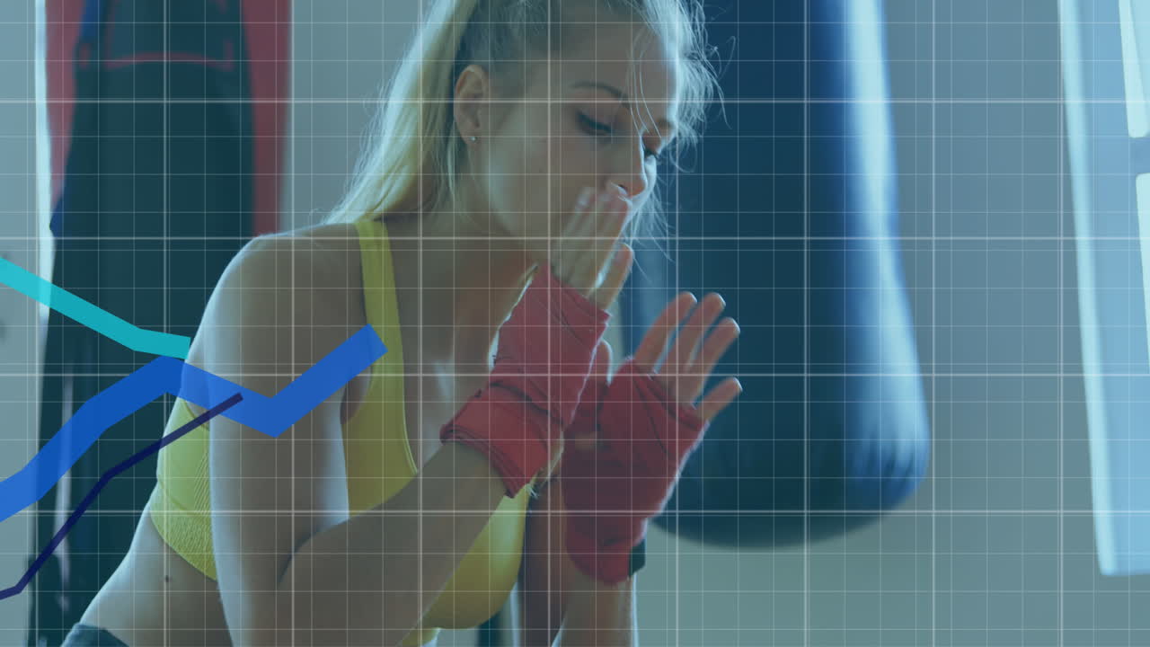 gráficos azules que se mueven sobre líneas de cuadrícula contra el reposo del boxeador femenino