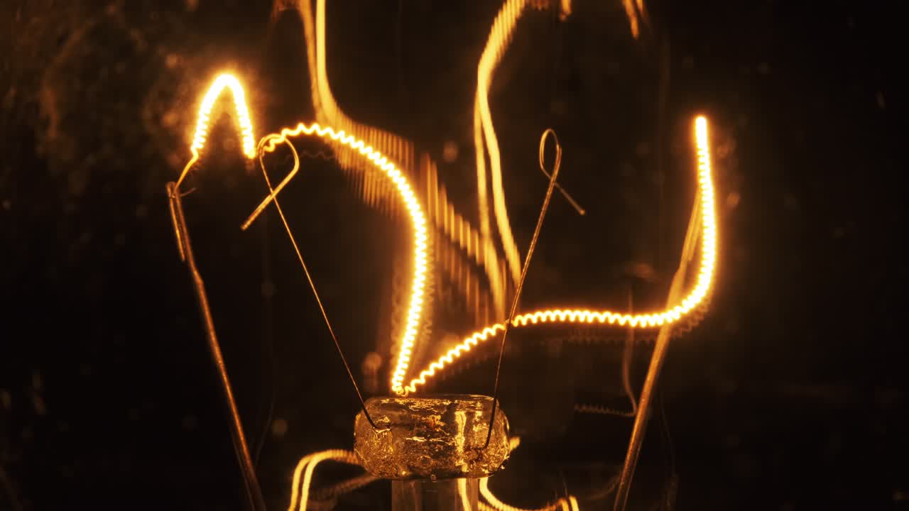 The Tungsten Filament in Classic Incandescent Glass Lamp Heats up and Cools Down