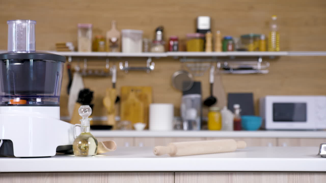 Kitchen with food processor and rolling pin