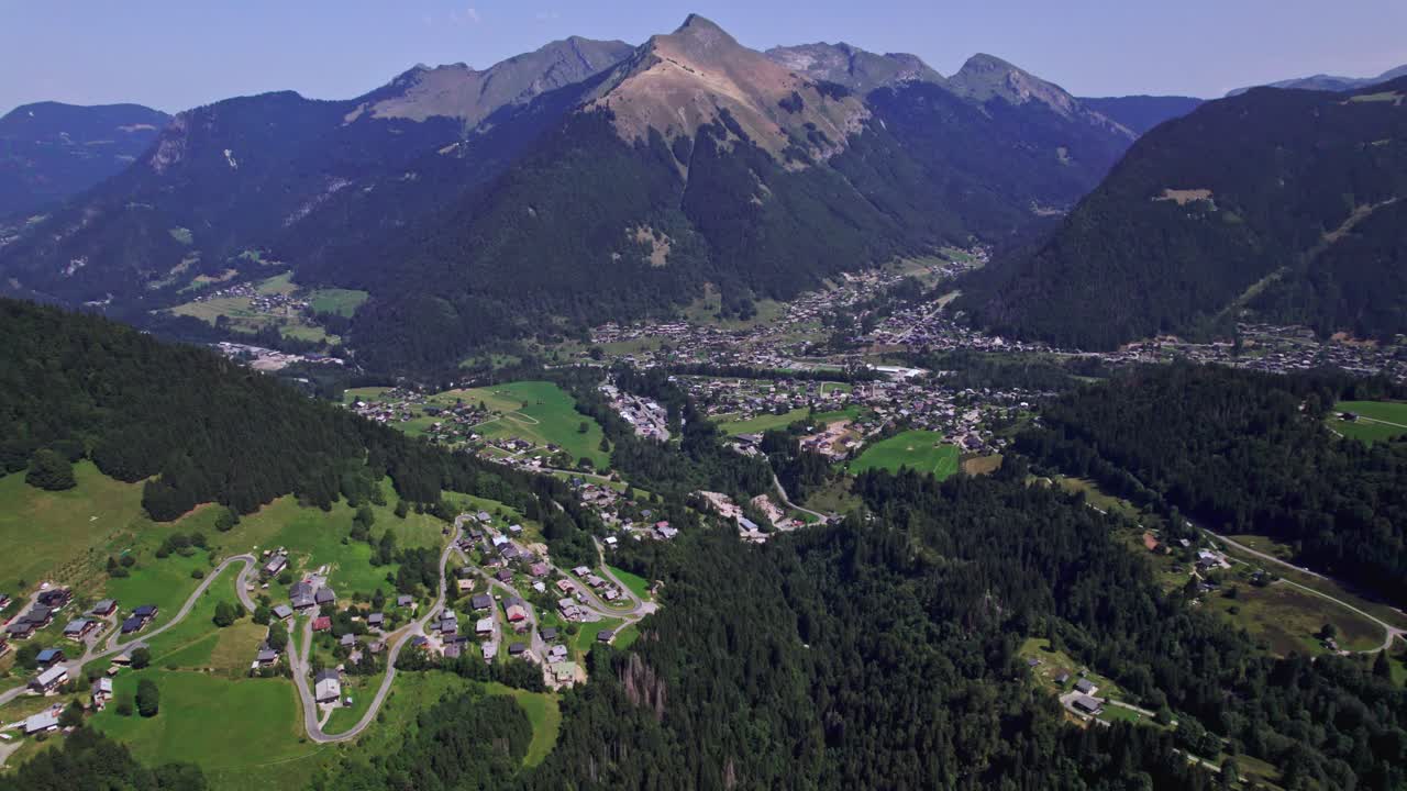 Scenic aerial view of a mountain valley with a town