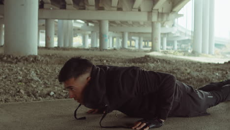 Man-Doing-Pushups-on-Urban-Street