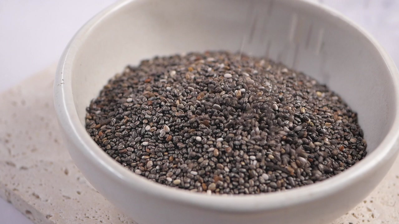 Healthy Chia Seeds Being Poured into a Bowl