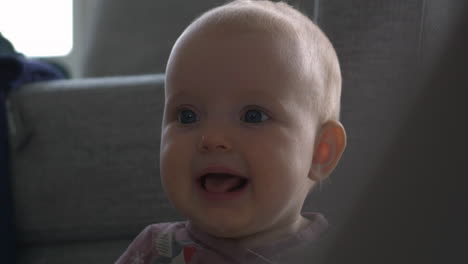 beautiful portrait of a happy baby girl smiling looking up