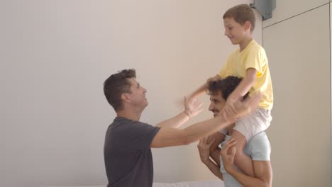 Joyful-kid-riding-on-dads-necks