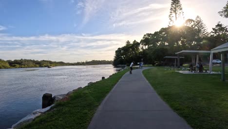 people enjoying a peaceful lakeside stroll