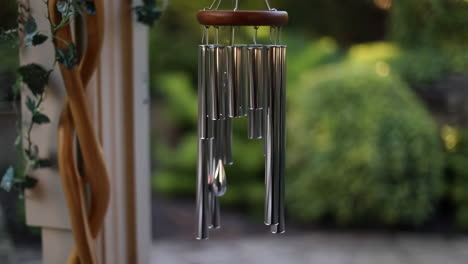 close-up of a wind chime hanging in a garden