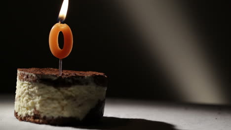 candle o in tiramisu cake