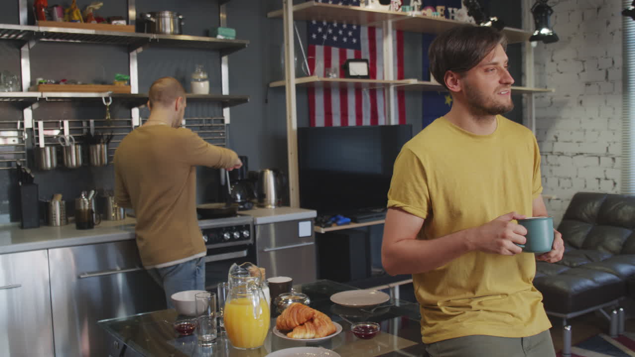 Cheerful Man Drinking Coffee and Smiling for Camera