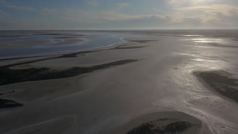 drone rising over the dramatic coast of lake tyrrell, victoria, australia