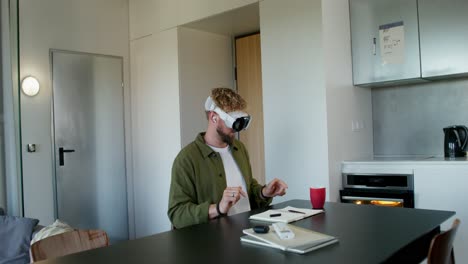 man using vr headset in modern kitchen