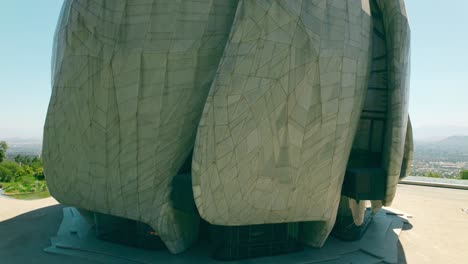 Boom-up-aerial-view-of-the-architecture-of-the-Bahai-Temple-of-South-America,-on-a-sunny-and-lonely-day