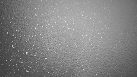 background of steaming hot water forms many water droplets on a glass surface