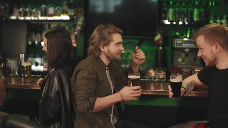 mates drinking beer at bar