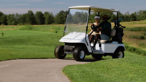 Caucasian-woman-and-african-american-man-on-the-golf-course.