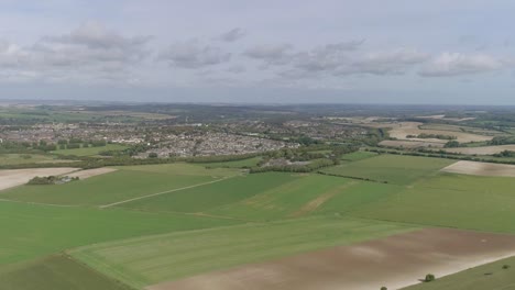 aerial tracking forward towards the historic town of dorchester from the south