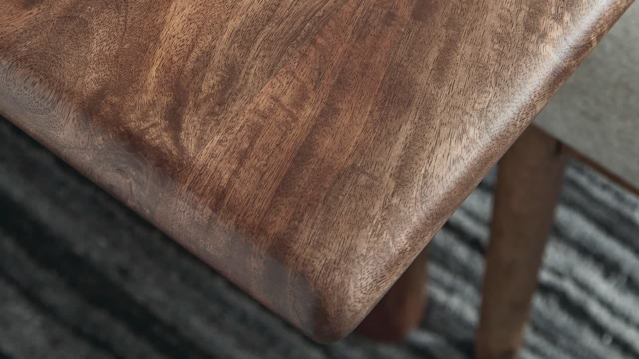 Camera zooms into the pristine corner, revealing rich grain