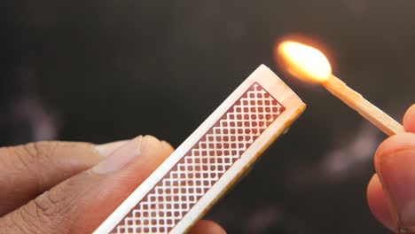 lighting a match