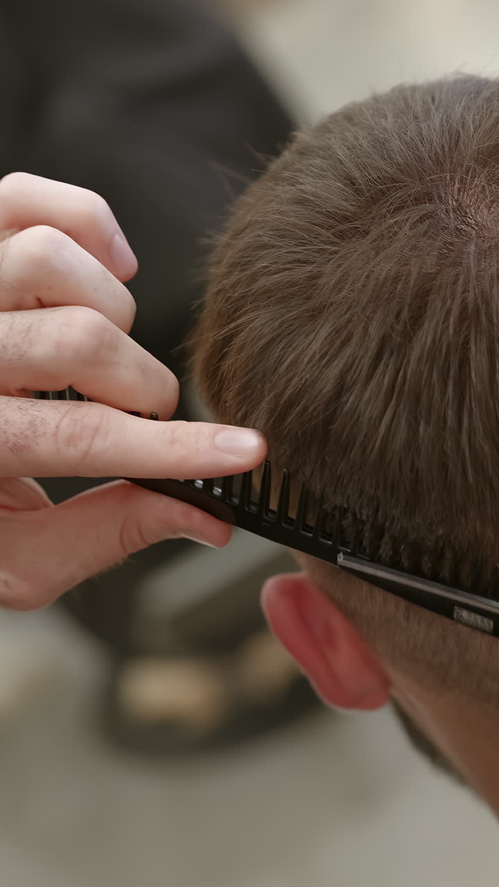 Haircut being done with comb and scissors