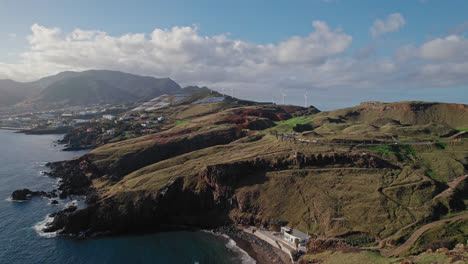 coastal volcanic landscape with wind turbines