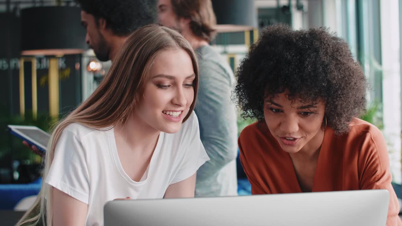 Business people working on computer at office desk