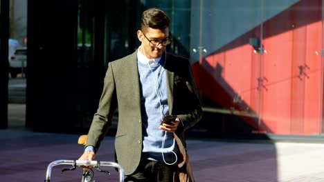 man using mobile phone while walking on street 4k