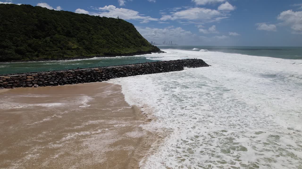 Rough Waves On Tallebudgera Seawall During Tropical Cyclone Alfred In Gold Coast, QLD Australia. Aerial Drone Shot