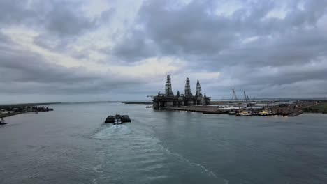 barge by oil rigs on the gulf of mexico drone footage