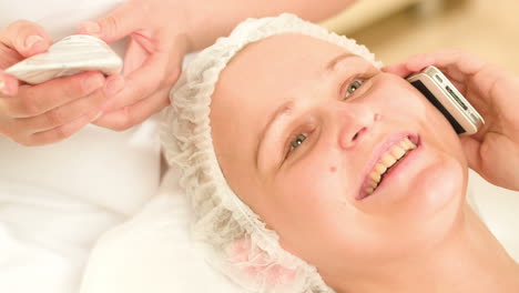 woman talking on the phone at beauty spa