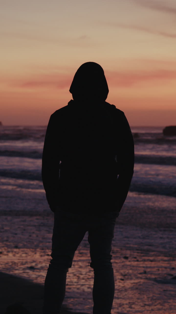Silhouette of a Person at Sunset Beach