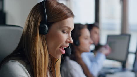 closeup inspired operator look idea in headset. joyful woman resolving problem