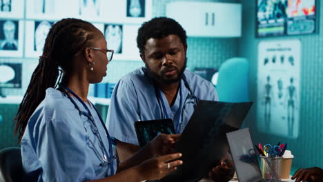 team of young nurses learning the practice from a doctor expert in the cabinet