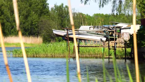 a boat tied to dock floating at bay