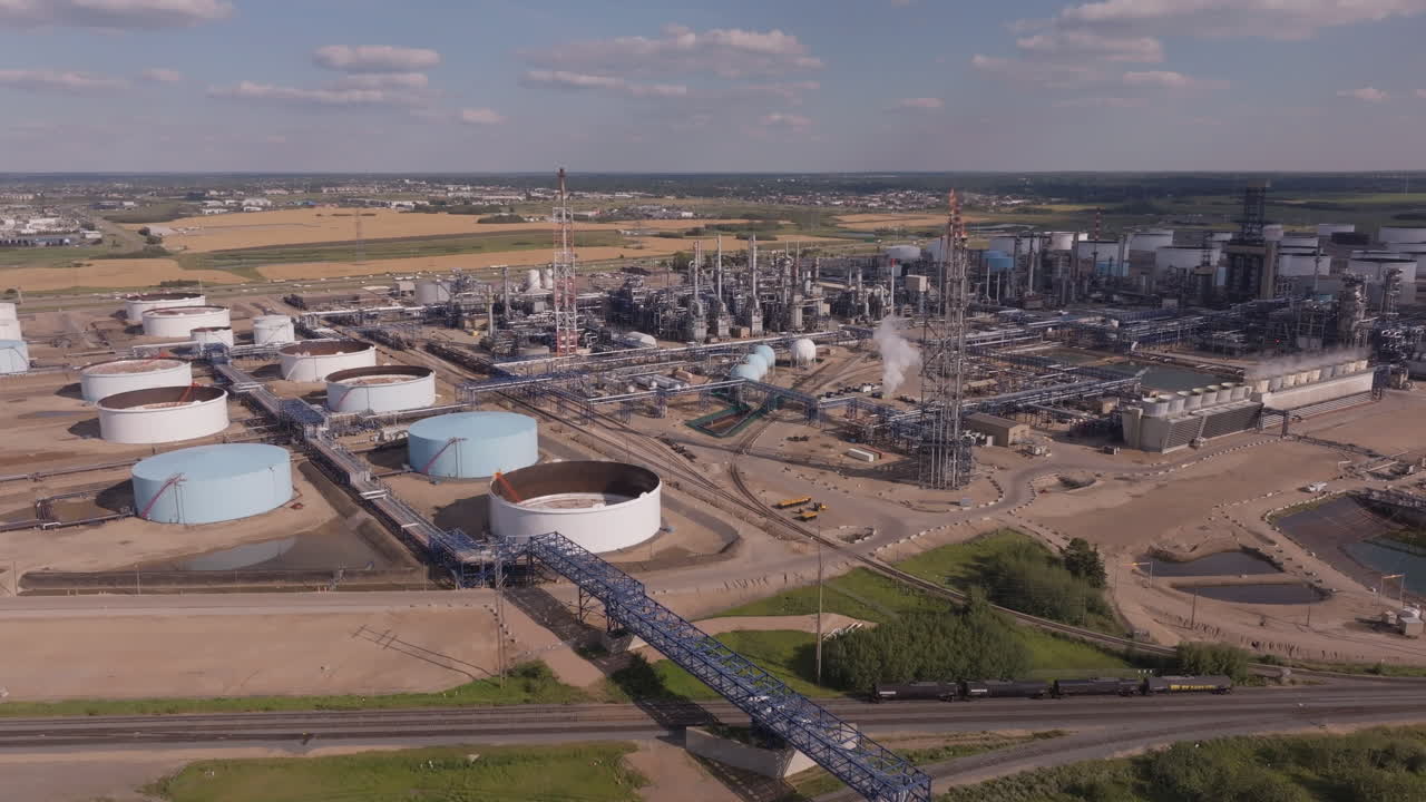 Aerial view of industrial refinery under a clear blue sky