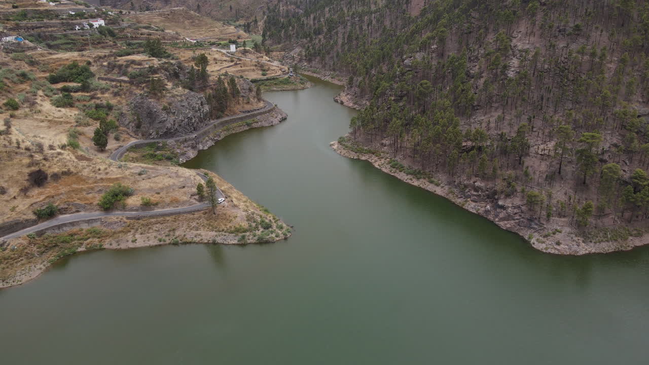 Los Perez y Lugarejos dam: aerial view traveling in to the fantastic dam and the grove that surrounds it