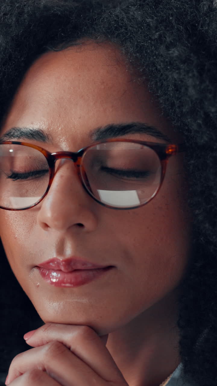 Close Up of Thoughtful Young Woman with Glasses Looking at Screen