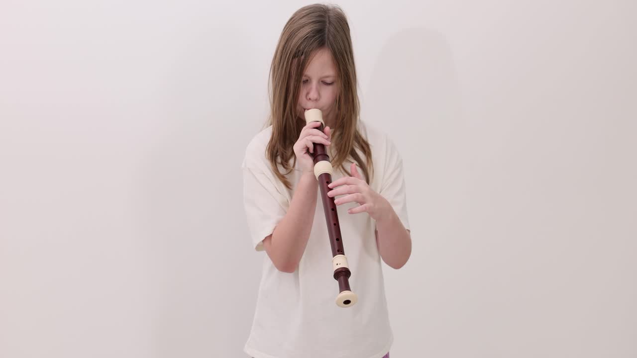 Girl playing a recorder