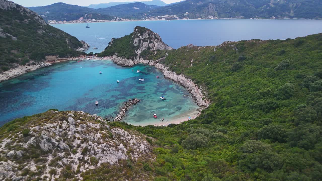 Stunning aerial view of a secluded beach lagoon with lush green surroundings