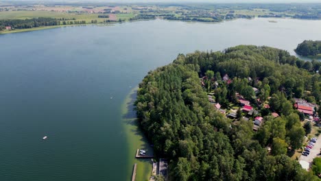 Drone view of a tourist village surrounded by a lake