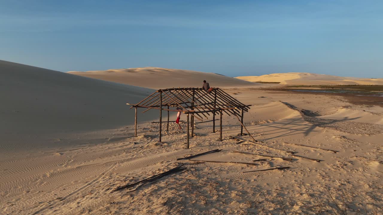 Native people build wooden huts for housing using woods for roofing, Parnaiba region deserted landscape, Aerial
