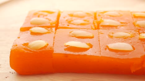 close up of indian sweet on a wooden plate