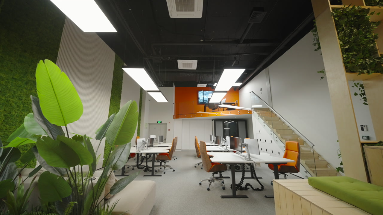 Vibrant Collaboration Hub With Plants And Bench Seating, Mezzanine And Open Plan Desks Ideal Team Workshop. Creative