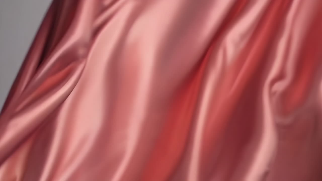 Close-up view of rose gold satin fabric
