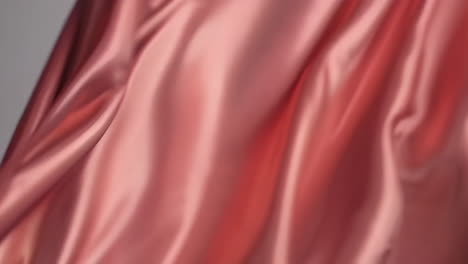 close-up view of rose gold satin fabric