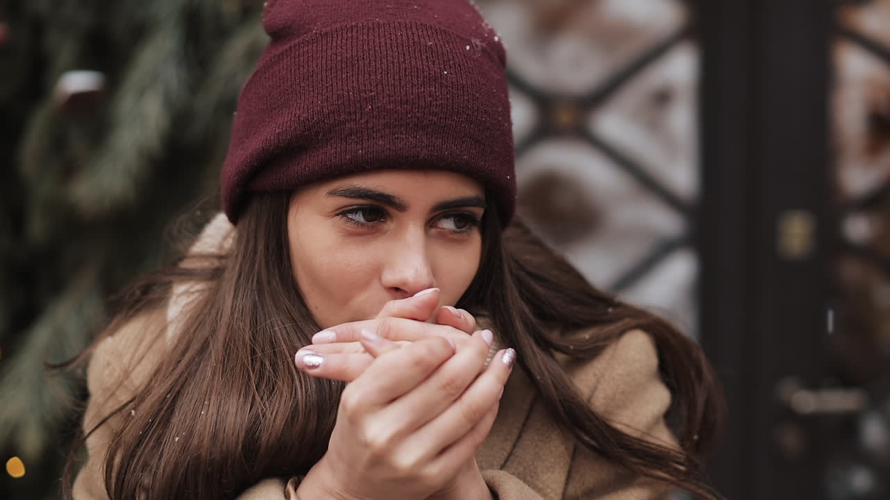 Young woman in winter clothing outdoors